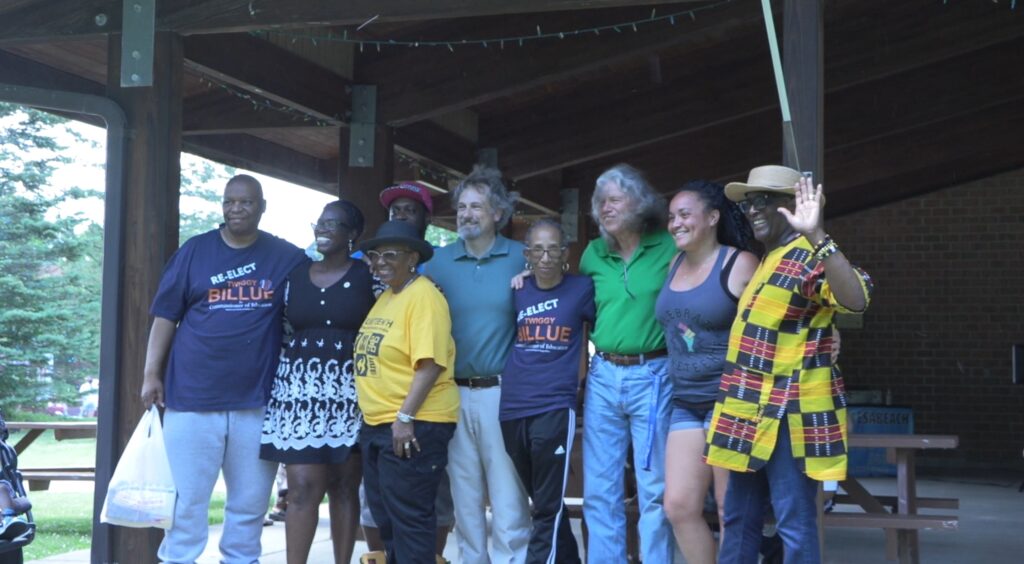 Group of event organizers pose for photo